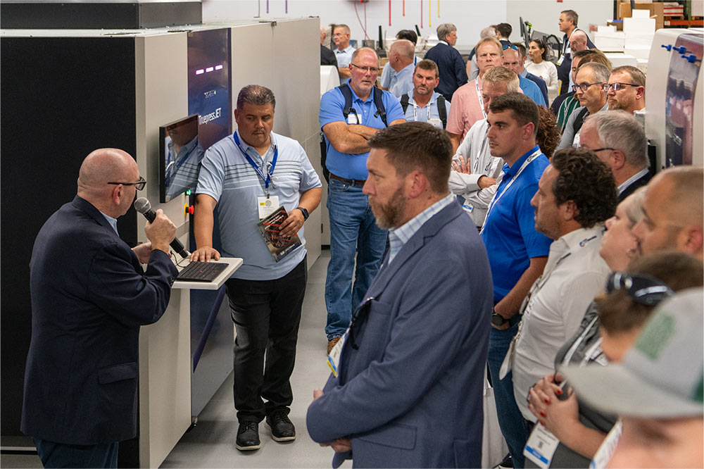 Product Manager Aron Allenson (with microphone) and Solutions Engineer Victor Perez answer questions on high-speed inkjet.